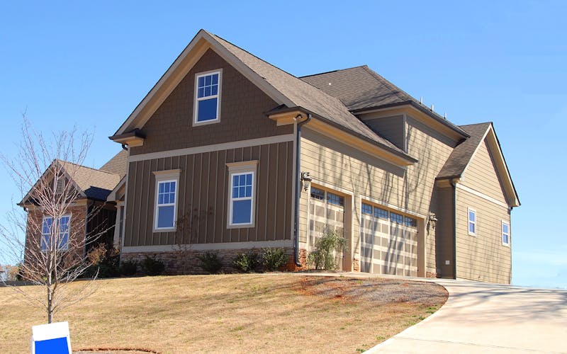 Clean house exterior after soft washing