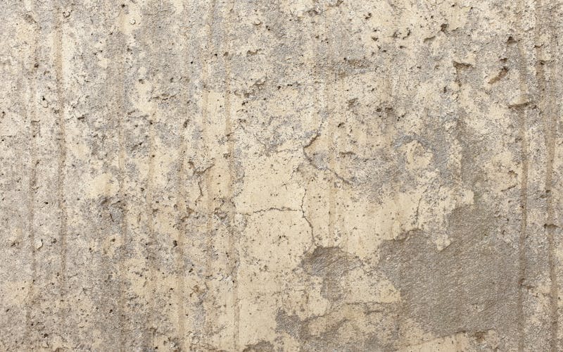 Weathered stained concrete before cleaning